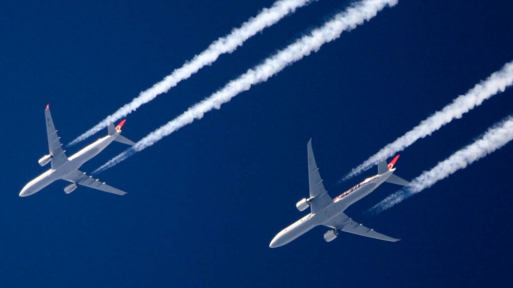 Why do airplanes leave white trails behind&nbsp;them?